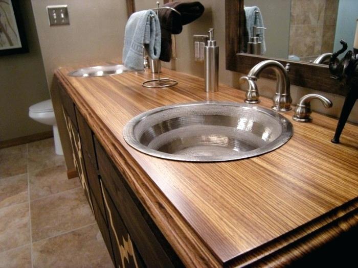 A Bathroom Remodeling project featuring wooden counter tops and sinks.