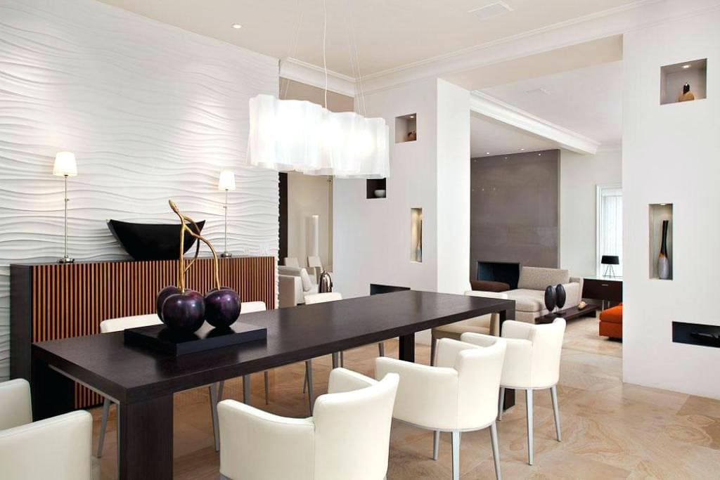 A modern dining room with a white table and chairs, perfect for remodeling any space.