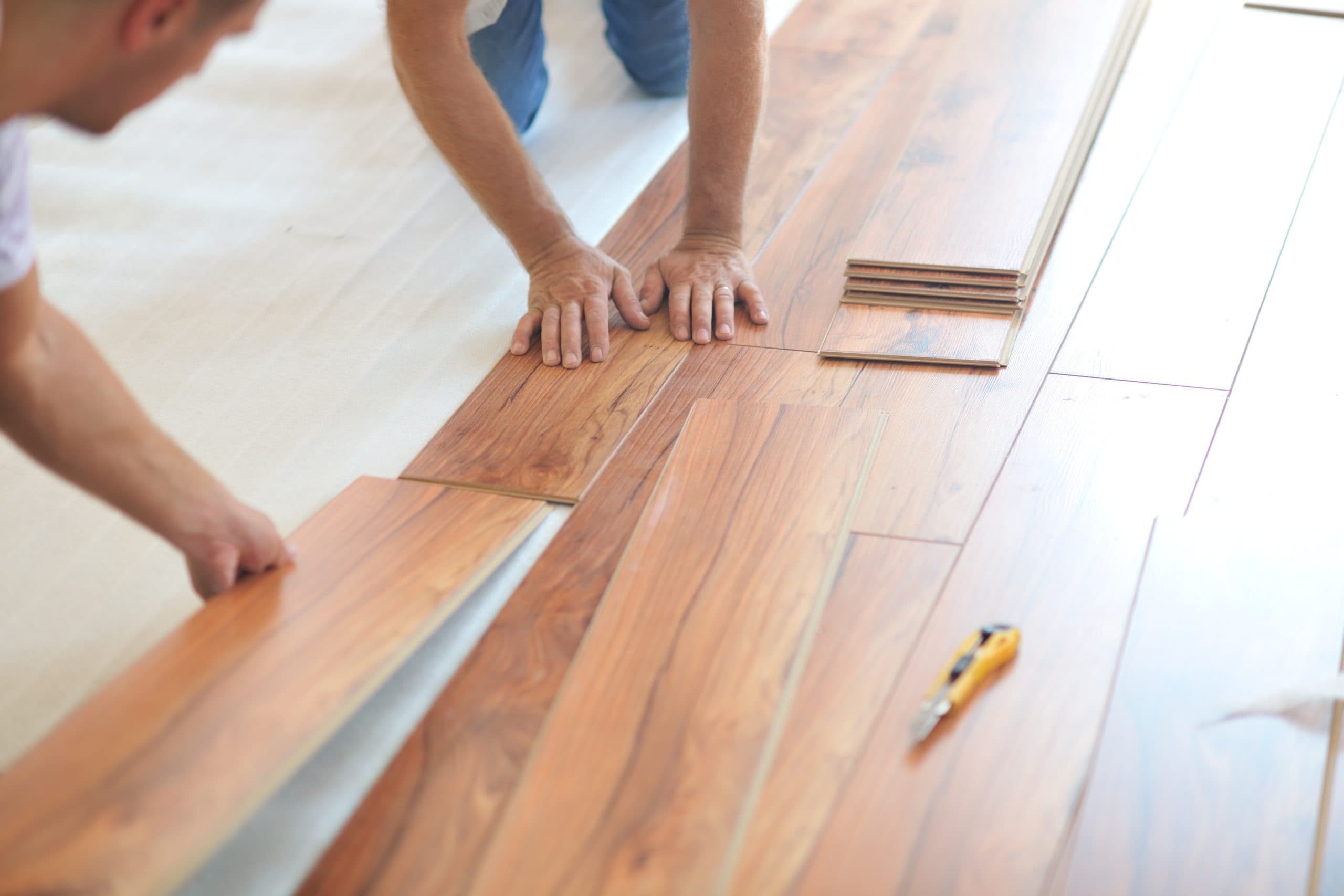 should you install floor or cabinets first