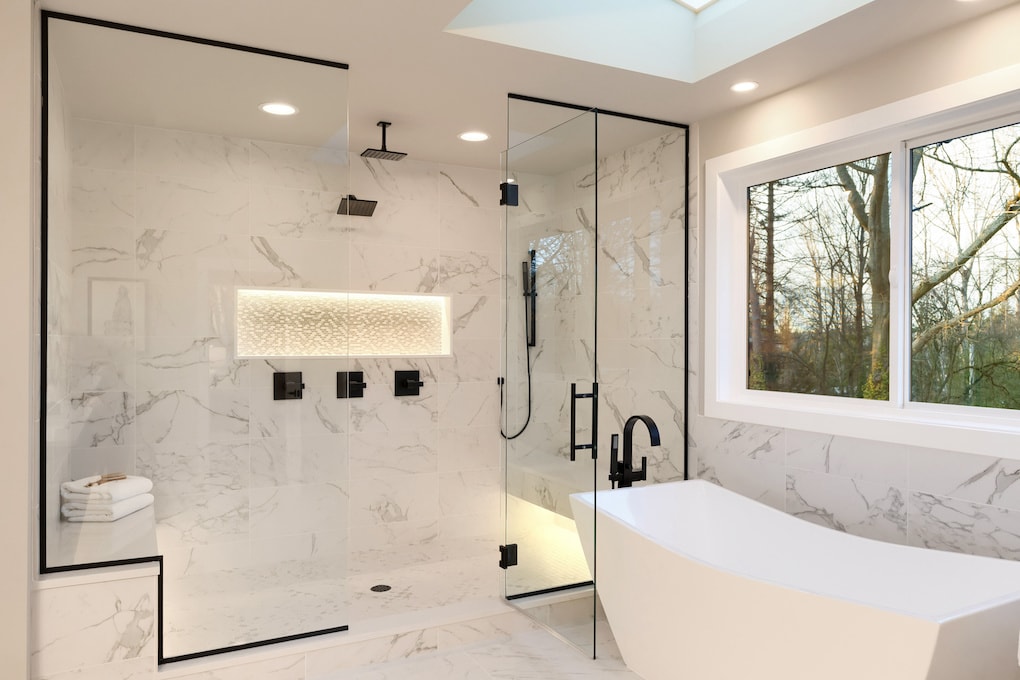 details of large white shower with marble
