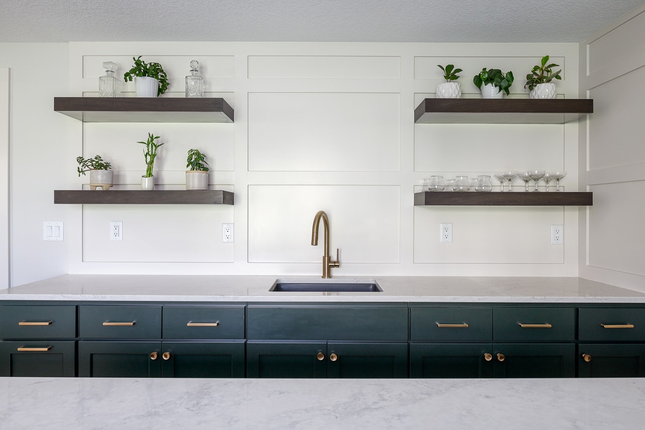 Sink with panelled wall and shelving
